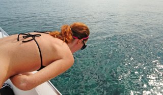 Woman seasick on a boat