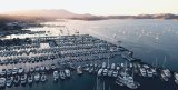 Crowded marina with yachts, vessels and sailboats