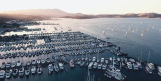 Crowded marina with yachts, vessels and sailboats