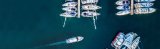 Boat slipping into tight marina