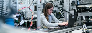 Young female engineer testing a product in development